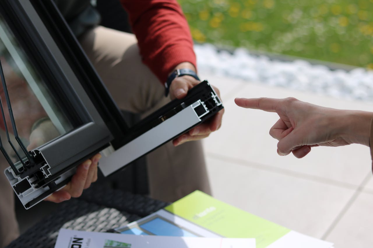 A Person Holding an Aluminum Frame